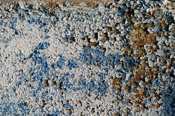Concrete wall. Peeling old paint. Concrete structure