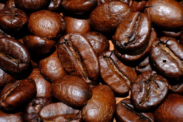 coffee beans on wood table and macro coffee beans background