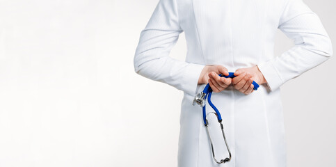 Cropped view of Woman Doctor in uniform standing and holding a stethoscope. Copy space for your text
