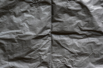 Black, creased, blank paper texture