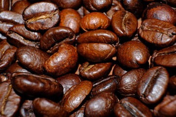 coffee beans on wood table and macro coffee beans background