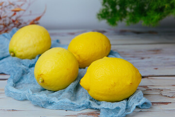 Group of fresh ripe lemon on an old vintage wooden table
