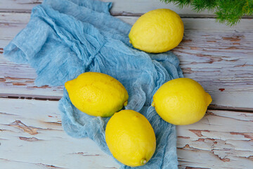 Group of fresh ripe lemon on an old vintage wooden table