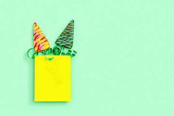 Lollipops shaped like Christmas tree. Creative  New Year Flat lay with sweet candy lollypops with...