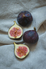 Fresh figs on a towel on a wicker tray