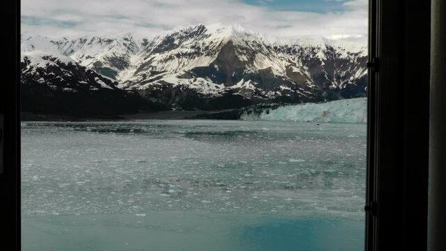 Frozen glacial fiord revealed through cruise ship window.