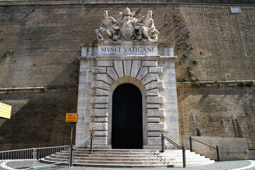 Main entrance of the Vatican museums. Portal with sculptural marble group.