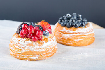Delicious puff pastries with berries and strawberry
