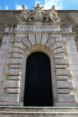 Main entrance of the Vatican museums. Portal with sculptural marble group.