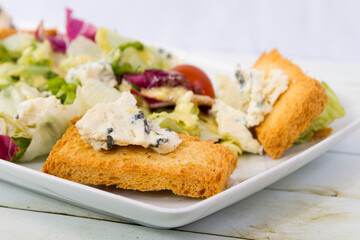 Salad with blue cheese from the side close up