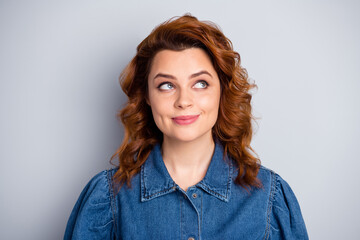Obraz premium Closeup photo of pretty curly foxy lady look up empty space dreamer person thinking over creative idea wear casual blue jeans denim shirt isolated grey color background