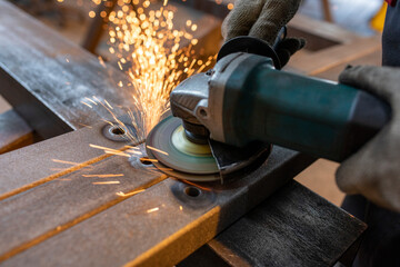 worker cutting metal with sparks