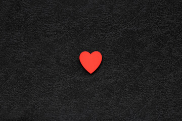 red heart in the middle of black background. Concept of love. Valentine's day background.