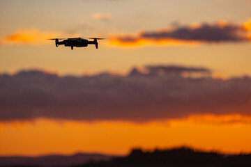 Fototapeta na wymiar Drone against the background of the setting sun