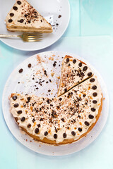 Mocha torte cake with coffee cream and coffee grains on top 