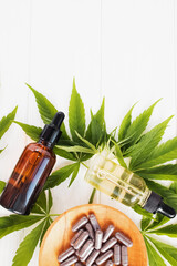 Cannabis CBD oil and hemp products on white table
