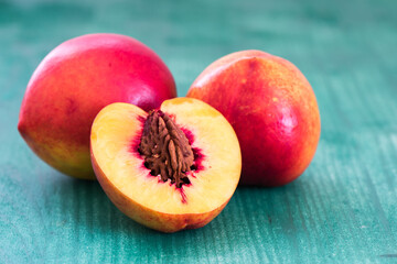 Fruit with slice on green background