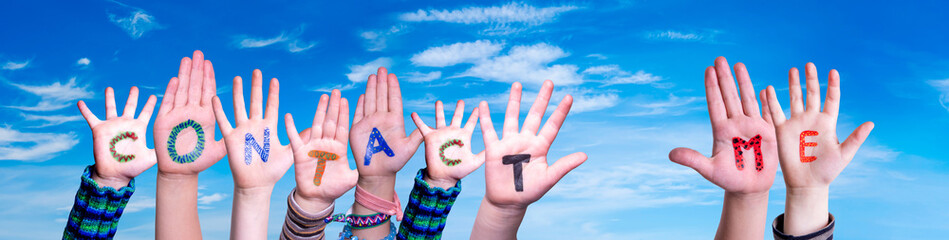 Children Hands Building Colorful Word Contact Me. Blue Sky As Background