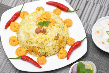 Biryani with shrimp Fish Biryani. Tasty and delicious prawns biryani, top view in traditional clay pot.