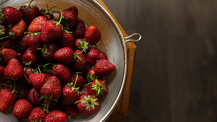 Washed, sweet, delicious strawberries in a colander only from the garden. - Powered by Adobe