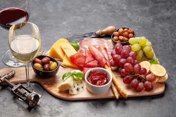 Cheese, meat, grapes and olives antipasto