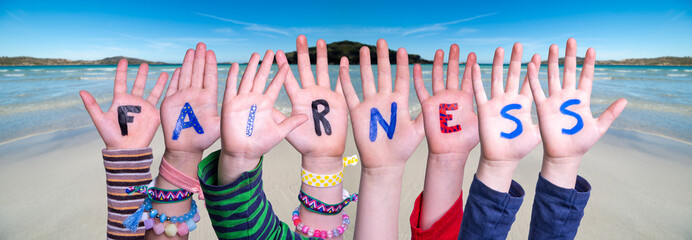 Children Hands Building Colorful Word Fairness. Ocean And Beach As Background