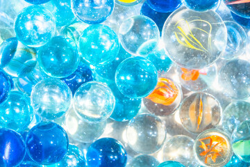 A Lot of Shining Colorful Marble Glass Balls under The Water, Summer Image