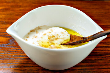 Homemade soft tofu made from soya milk, topped with rock soil and olive oil