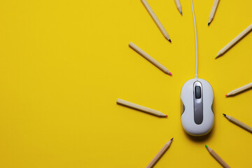 Pc mouse, contour colored pencils, yellow background with space for text