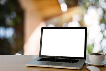 laptop on the wood desk.