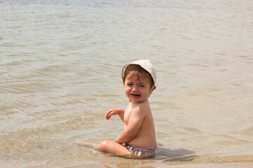 baby alone in the beach