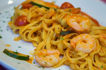 Delicious homemade Italian pasta with shrimps and parmesan cheese