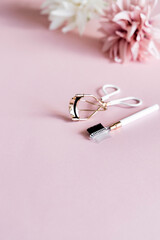 Cosmetic products pink background.