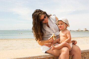 Fototapeta premium mother and baby in the beach