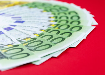currency of the European Union of different denominations on an red background 5