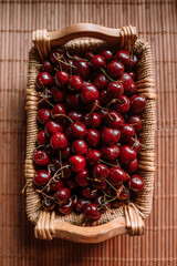 Cherries. Cherry. Cherries in wood bowl. Red cherry. Fresh cherries. Cherry on background. healthy food concept.