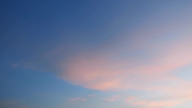 TimeLapse of cirrus clouds turn to Angle wings or free bird formation building with fluffy pink cumulus cloudscape moving on tropical summer morning sunrise or evening twilight sunset horizon    