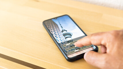 man who edit photography with a mobile phone