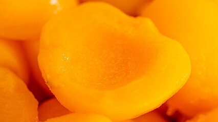 Peaches, sliced ​​in half, appetizing yellow.