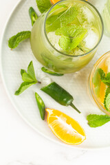chilled cocktail with mint and lemon.