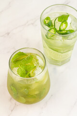 green cocktails with ice and mint.