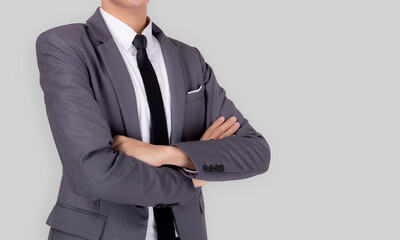 Business asian man in suit crossed his arms stand isolated on white.