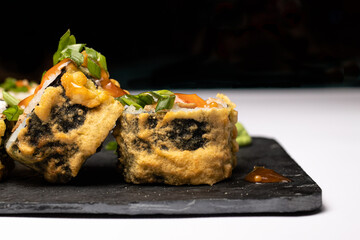 Sushi and rolls on a white isolate background. Japanese food, seafood and raw fish with wasabi sauce, Macro photo.