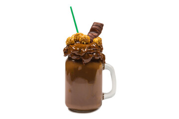 Chocolate milkshake with whipped cream, cookies, waffles, served in glass mason jar. 