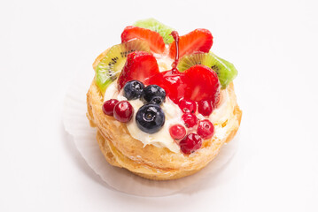 Home made cake with cream and fruits isolated.