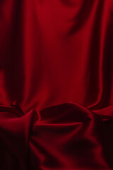 Red silk or satin luxury fabric texture can use as abstract background.
