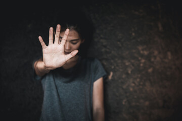 woman making NO or STOP gesture with hand, Stop drugs, Stop violence against children, stop violence against women, human rights violations, human trafficking