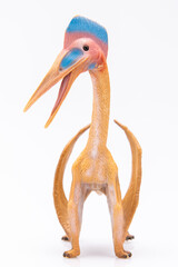 close-up of a plastic pterodactyl colorfull figurine isolated on a white background