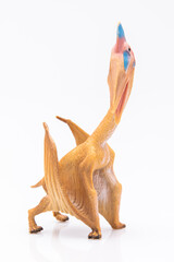 close-up of a plastic pterodactyl colorfull figurine isolated on a white background