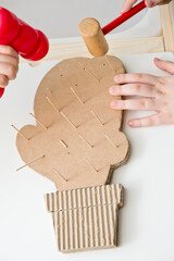 DIY toys. Corrugated cardboard cactus with wooden toothpick spikes. Montessori methodology tool on concentration and fine motor measurement. 5 minute crafts, easy game ideas. Montessori methodology.